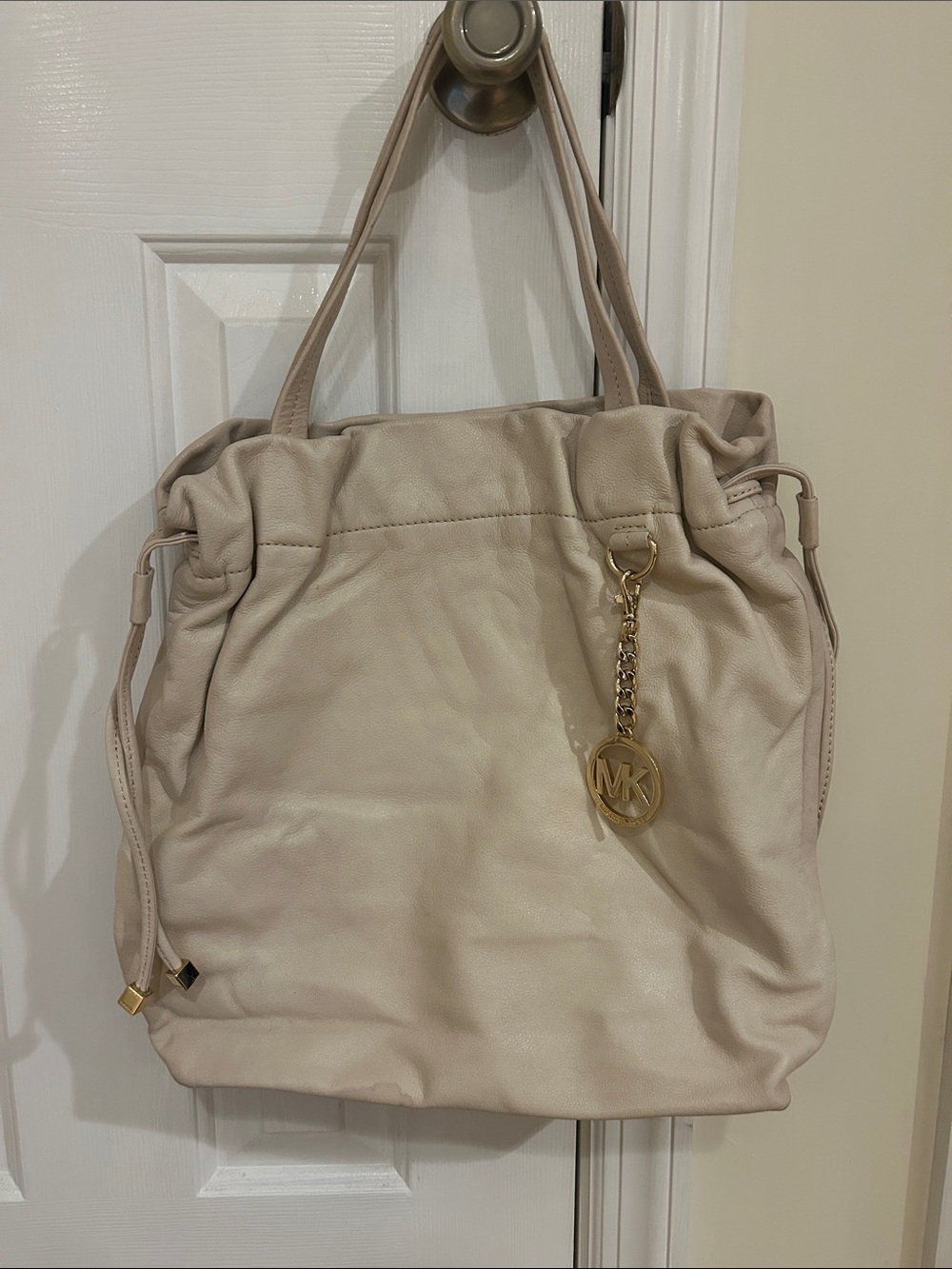 Michael Kors Cream Leather Drawstring Shoulder Bag with Gold MK Charm